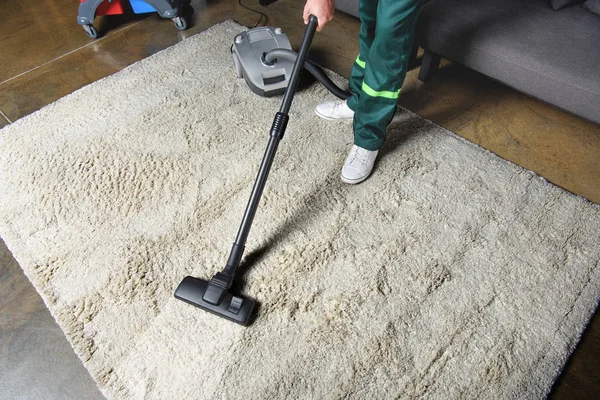 Technician cleaning carpet in Malden, MA home